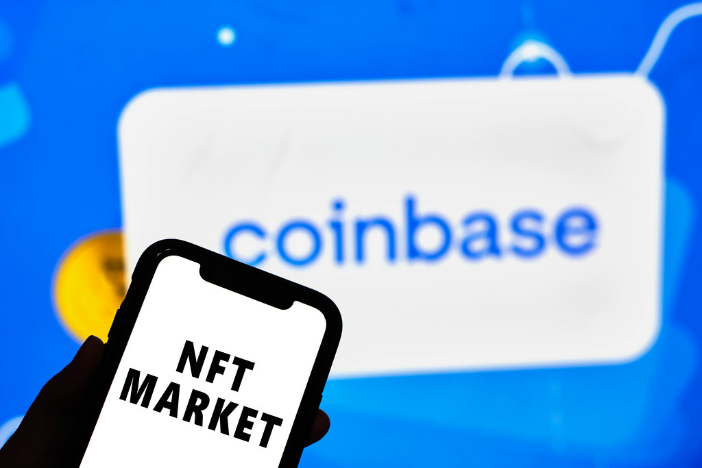 coinbase logo with NFT market sign in front of it