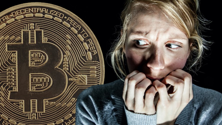 FUD acronym - shows a woman looking in horror at the bitcoin currency