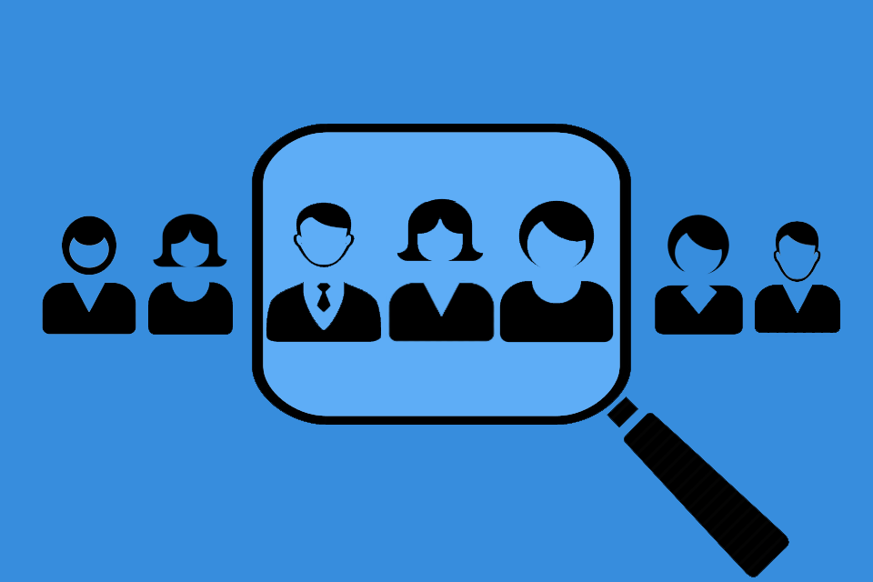 illustration of a magnifying glass pointing at a group of people along with a blue background