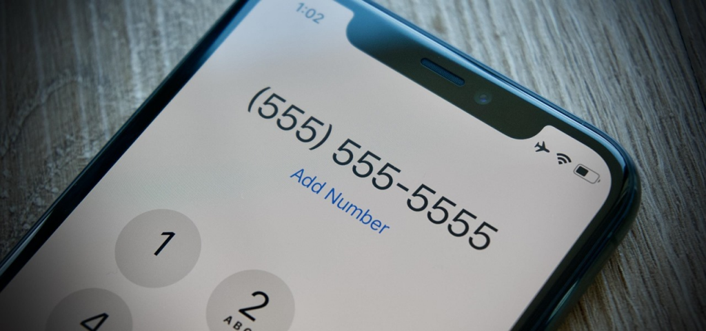 picture of a phone displaying a random number on call app