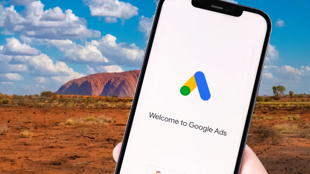 Someone accessing the Google Ads app in a phone on a Australian desert.