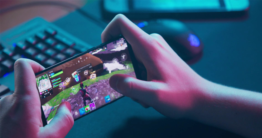 Someone playing Fornite on his smartphone