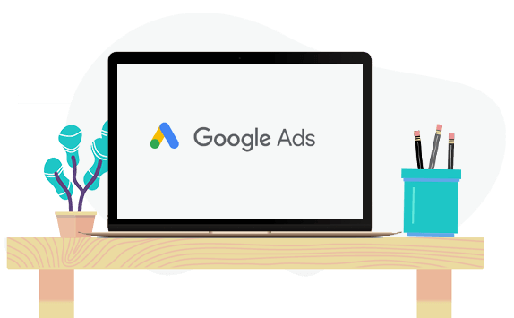 illustration of a laptop on a desk with the text Google Ads on its screen