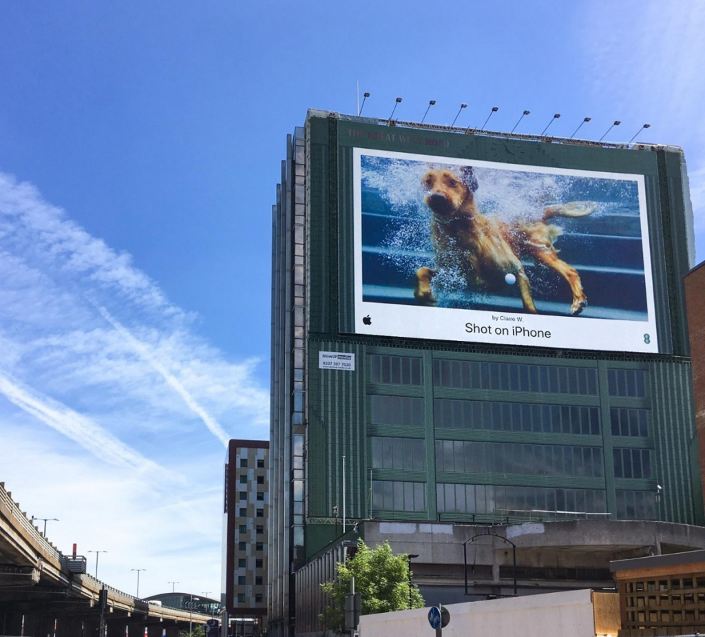 picture from a building displaying Apple's shot on iPhone campaign