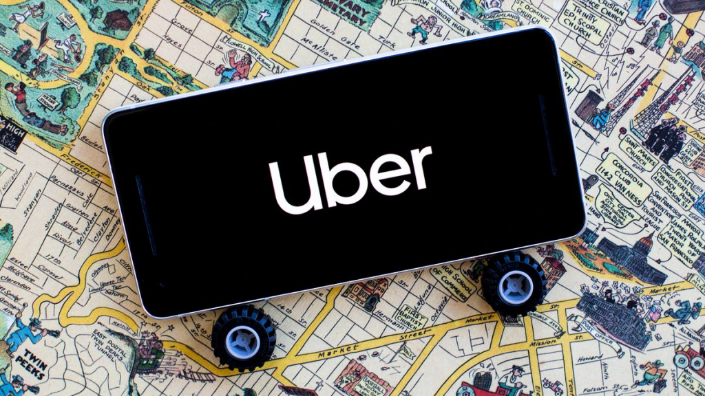 image of a map with a smartphone on the top displaying Uber's logo